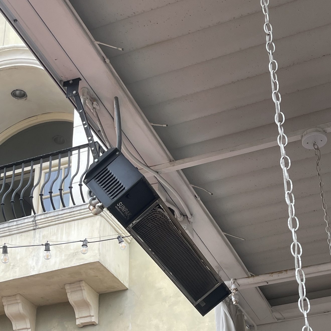Sunpak wall-mount heater installed on a restaurant patio